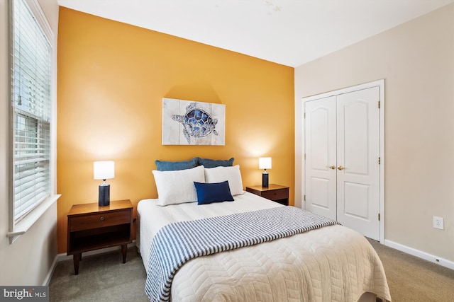 carpeted bedroom with a closet