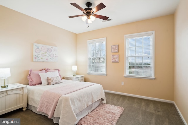 bedroom with dark carpet and ceiling fan