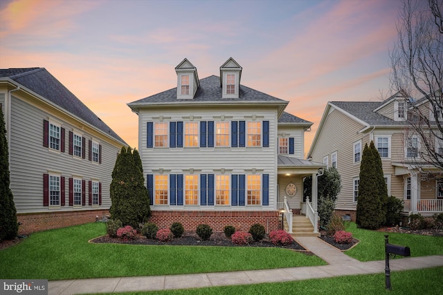 colonial house with a lawn