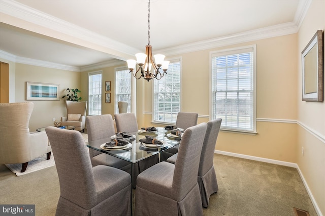 dining room featuring ornamental molding, light carpet, and a notable chandelier