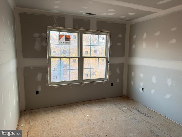 spare room featuring visible vents