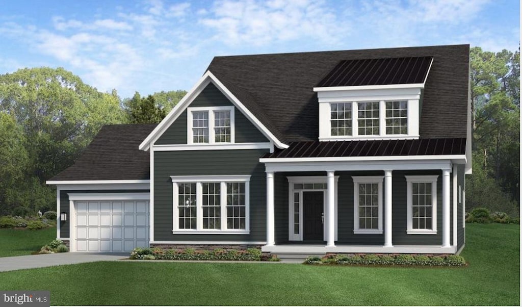 view of front of property featuring a garage, covered porch, and a front lawn