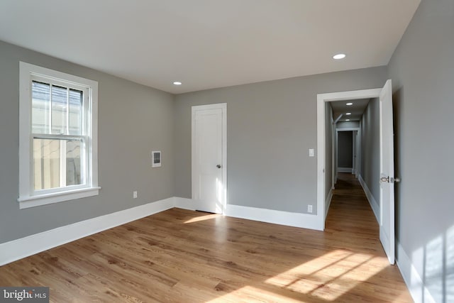 spare room featuring light wood-type flooring