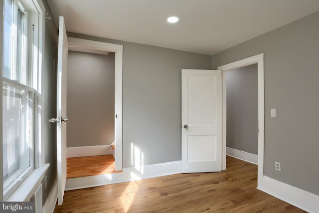 unfurnished bedroom featuring wood-type flooring