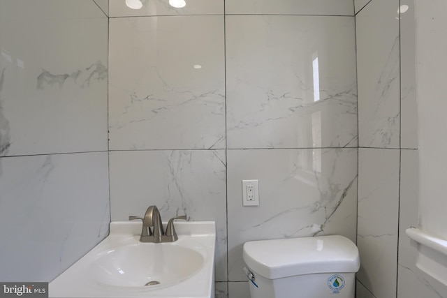 bathroom featuring sink and toilet