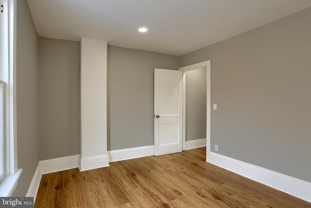 unfurnished room with light wood-type flooring