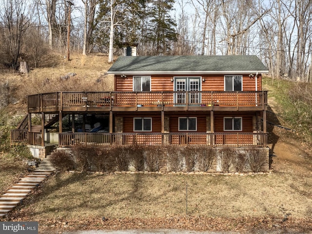 exterior space featuring a wooden deck