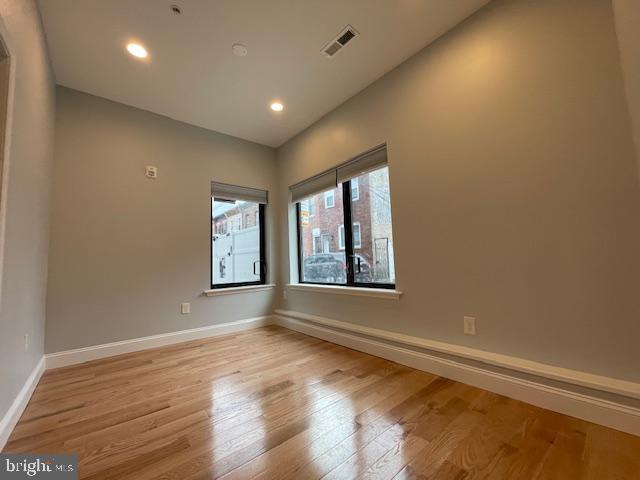 empty room with light wood-type flooring