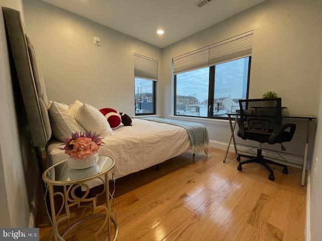 bedroom with light wood-type flooring