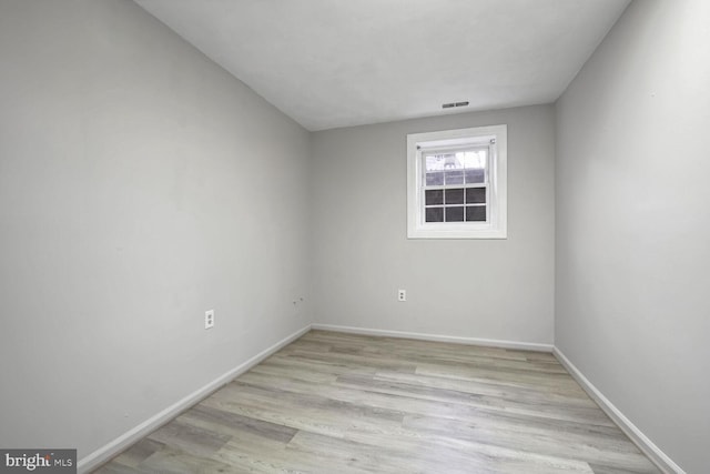 spare room featuring light wood-type flooring