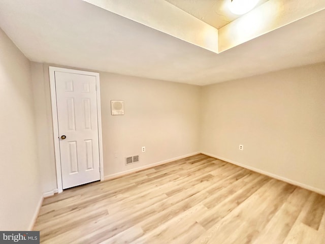 spare room featuring light hardwood / wood-style floors