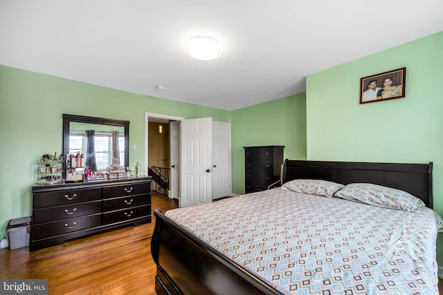 bedroom with hardwood / wood-style flooring