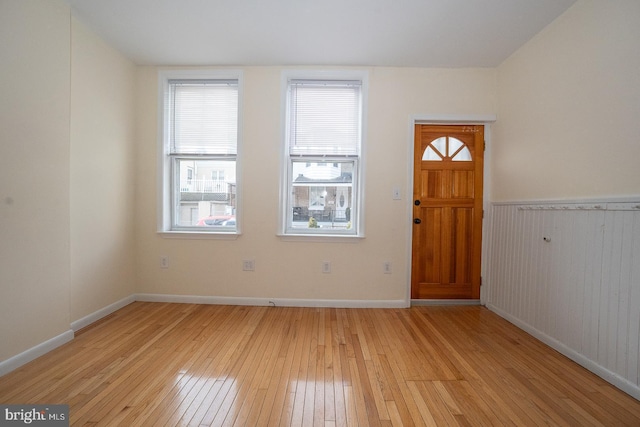 foyer entrance with light hardwood / wood-style floors