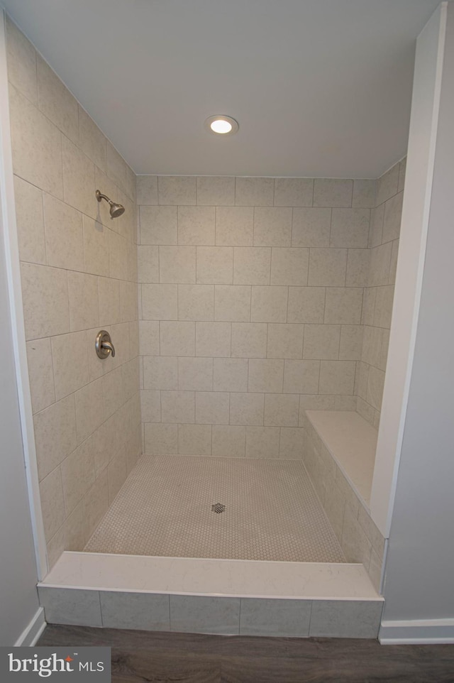 bathroom featuring tiled shower