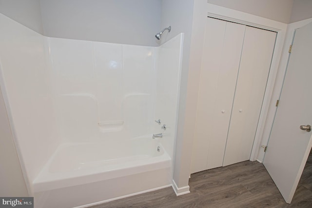 bathroom featuring hardwood / wood-style floors and shower / tub combination