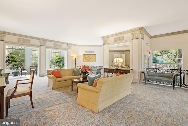 carpeted living room with ornamental molding and a healthy amount of sunlight