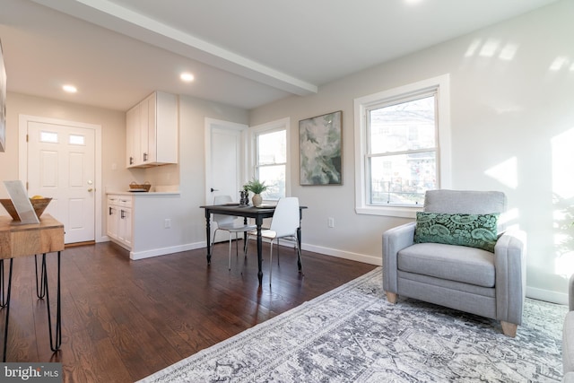 office with beamed ceiling and dark hardwood / wood-style floors