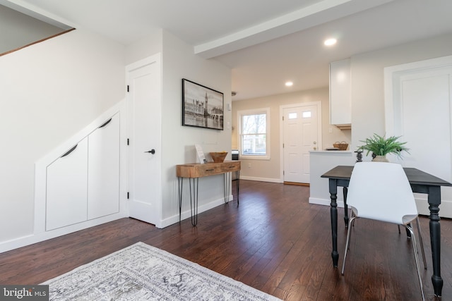 foyer entrance with dark wood-type flooring