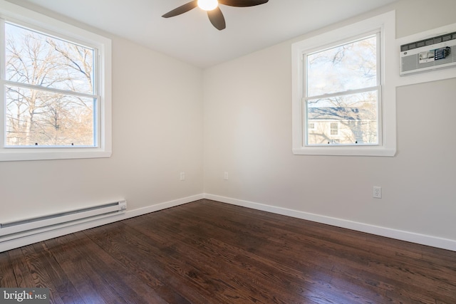 empty room with ceiling fan, dark wood-type flooring, a wall unit AC, and baseboard heating