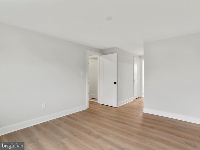 spare room featuring light hardwood / wood-style floors