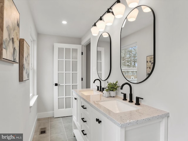 bathroom with vanity and tile patterned floors