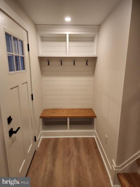 mudroom with dark hardwood / wood-style flooring