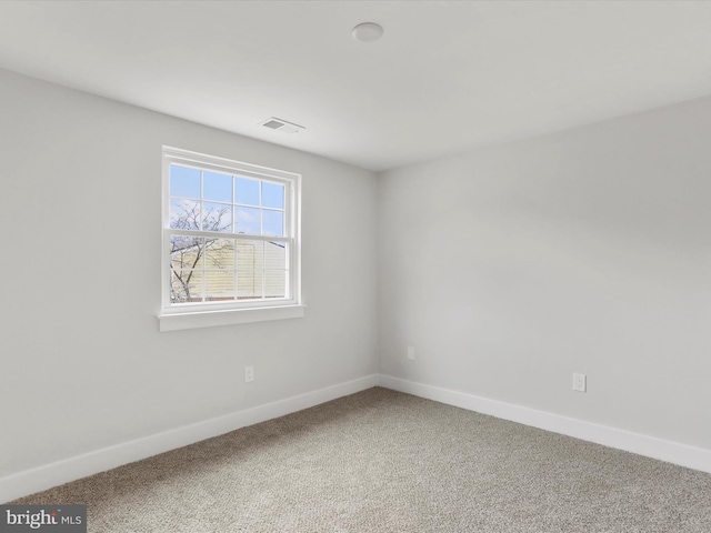 unfurnished room with carpet flooring