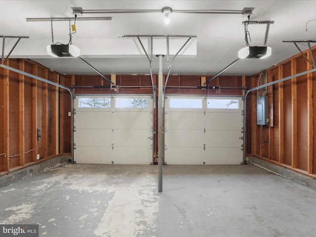 garage featuring a garage door opener and electric panel