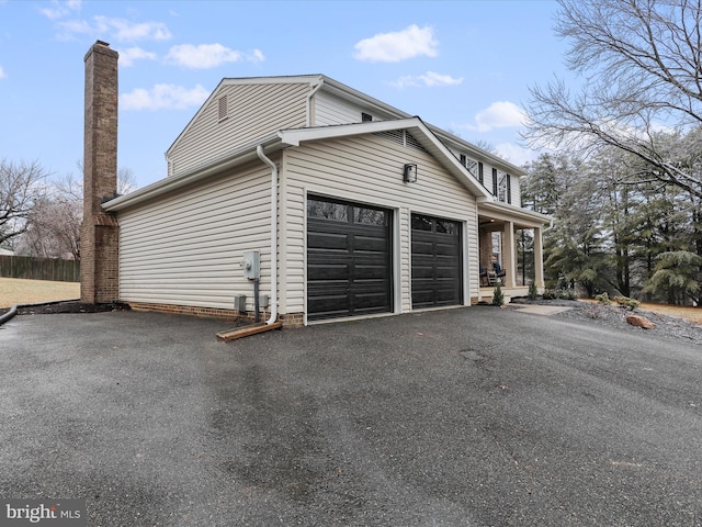 view of side of property featuring a garage