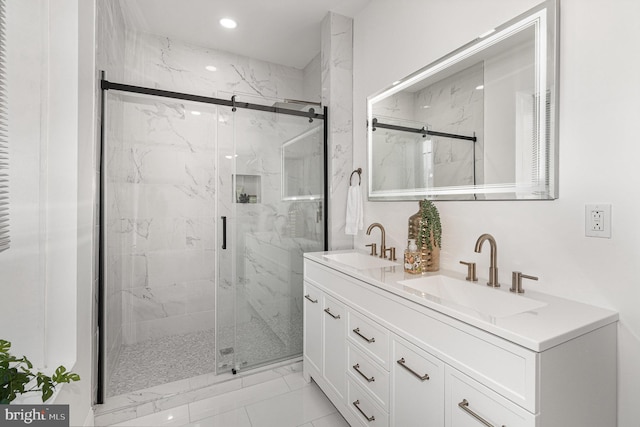 bathroom featuring vanity and a shower with door