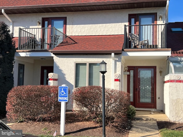 doorway to property featuring a balcony