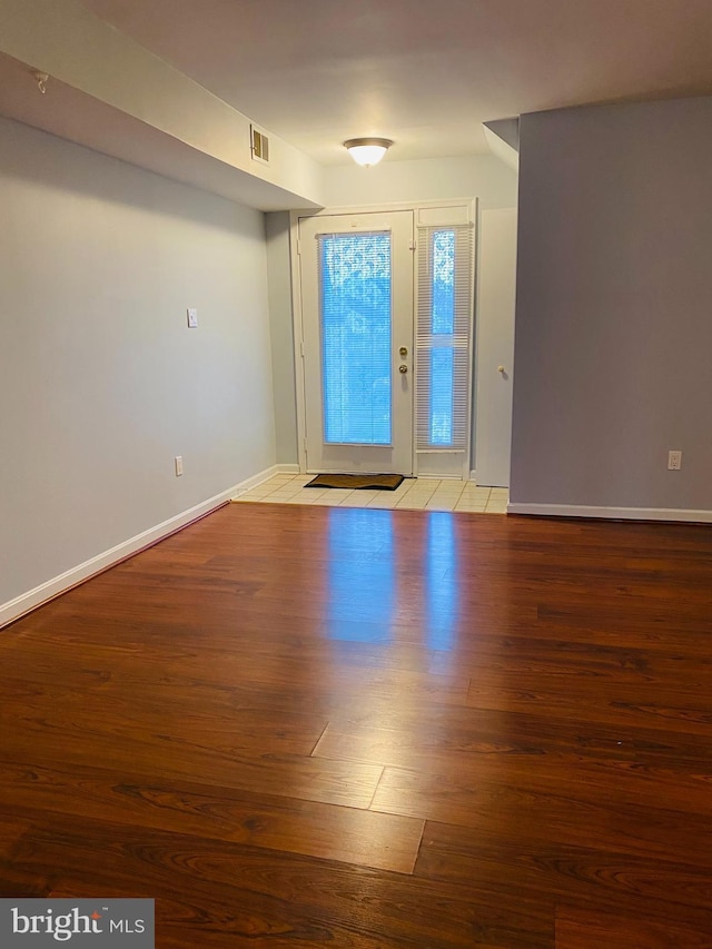 foyer entrance with light wood-type flooring