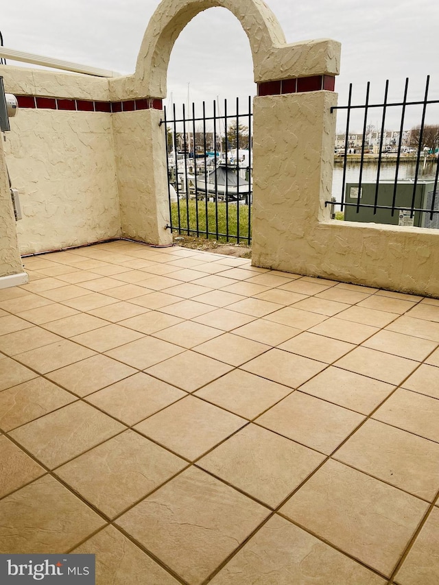 view of patio with a water view