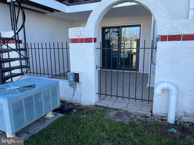 property entrance featuring central AC