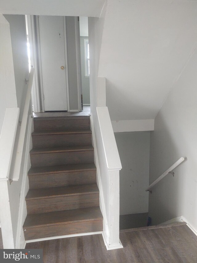 stairs with hardwood / wood-style flooring