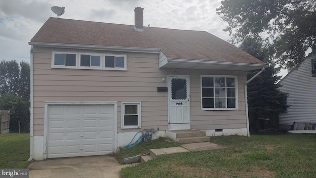 view of front facade featuring a garage and a front yard