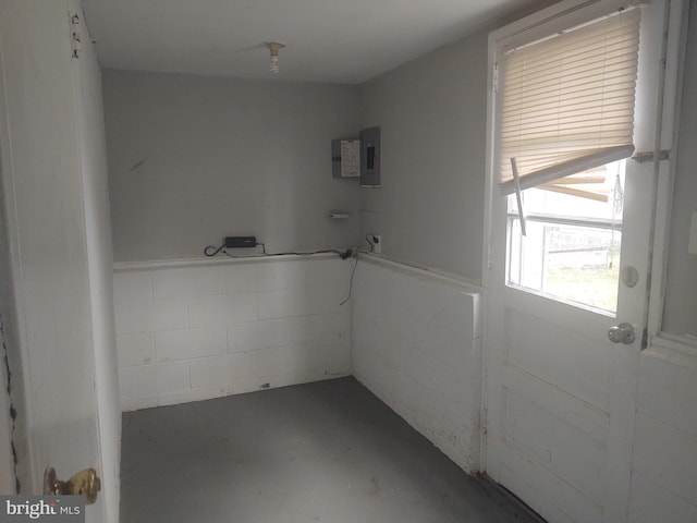 interior space featuring concrete flooring and electric panel