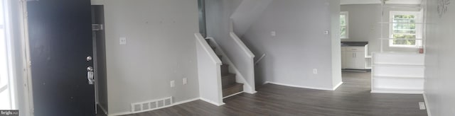 staircase featuring hardwood / wood-style floors