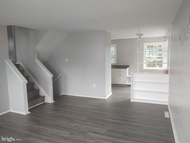 interior space with dark hardwood / wood-style flooring