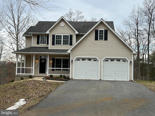 view of front of property with a porch and a garage