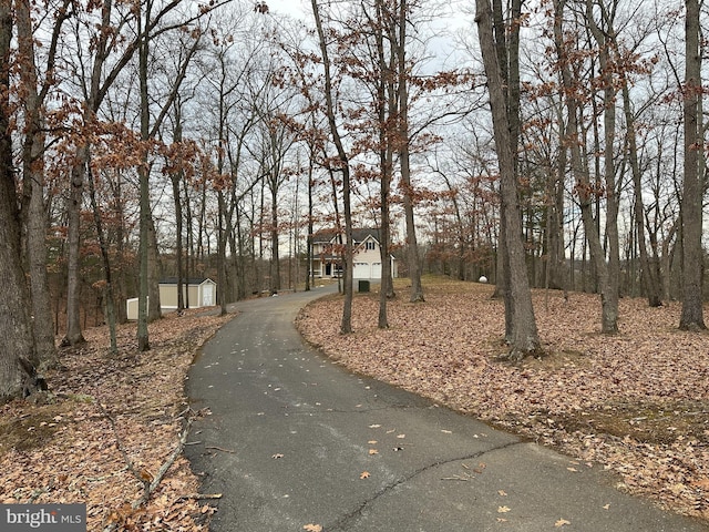 view of home's community with a storage shed