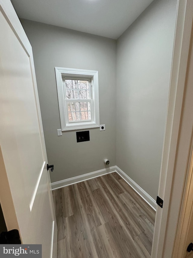 laundry area with hardwood / wood-style floors and hookup for an electric dryer