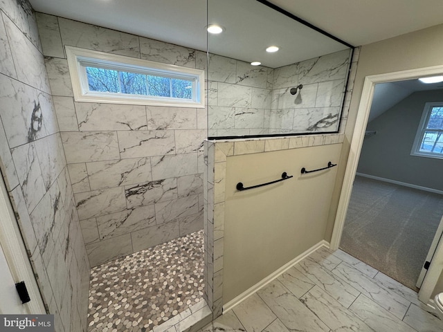 bathroom featuring tiled shower