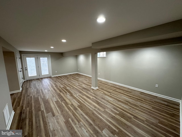 basement featuring hardwood / wood-style floors