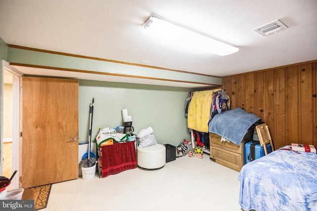 bedroom with wood walls