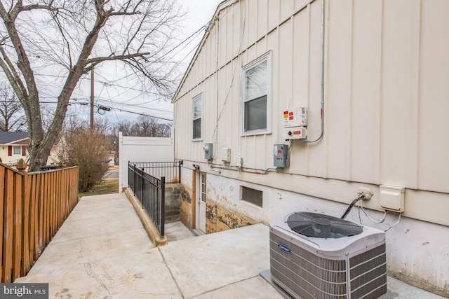 view of property exterior with central AC and a patio area