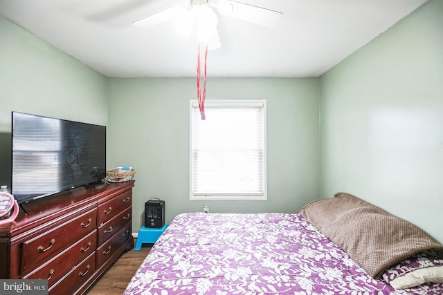 bedroom featuring dark hardwood / wood-style flooring and ceiling fan