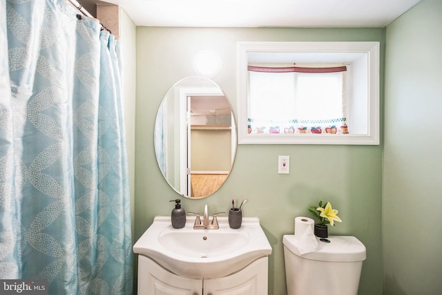 bathroom featuring vanity and toilet