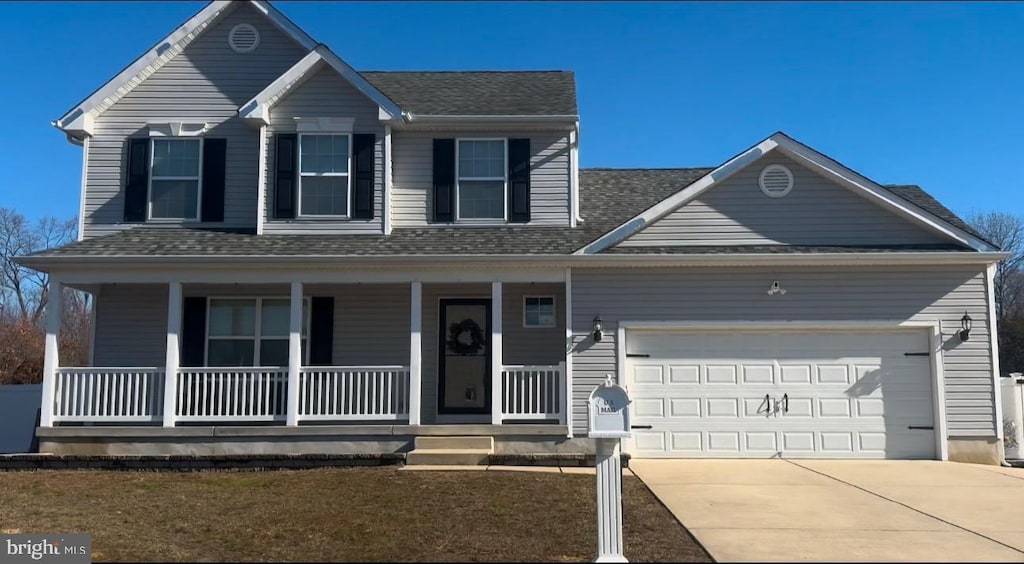 view of front facade featuring a garage and a porch