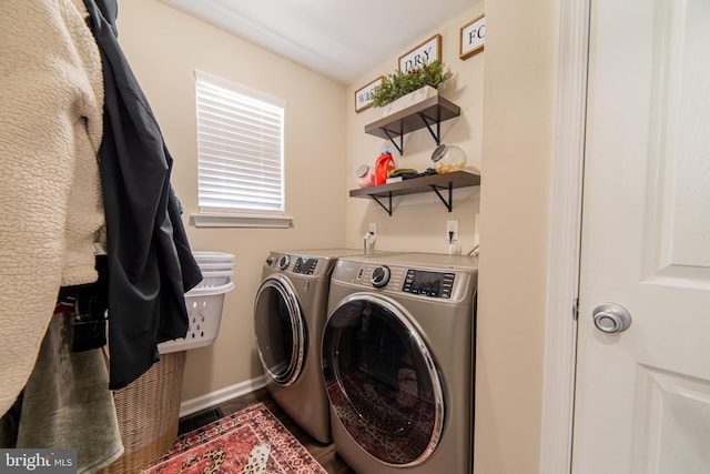 laundry room with washing machine and clothes dryer